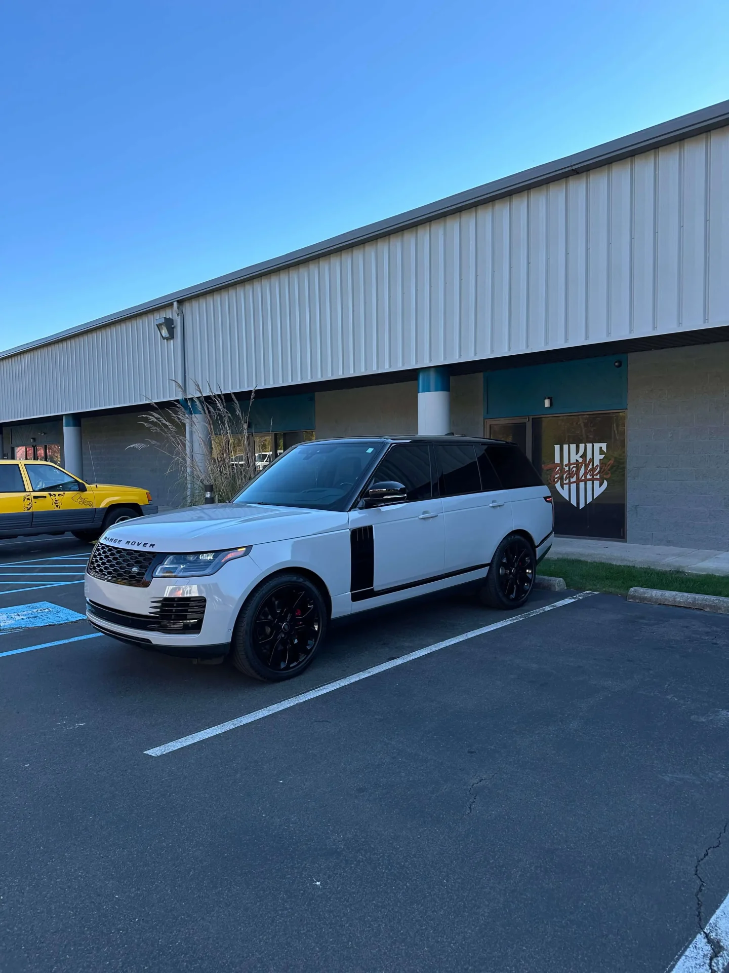 white range rover standing near ukie brother's office
